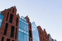 Kaboompics - Red Brick and Glass Gdansk Architecture Against Blue Sky