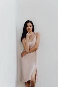 Kaboompics - Asian Woman in Pale Slip Dress Touching Her Face