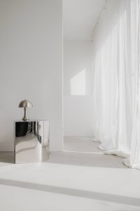 Kaboompics - Pantone Color of the Year 2026: Minimal White Room with Chrome Table