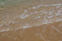 Kaboompics - Shallow Sea Ripples Over Sandy Beach
