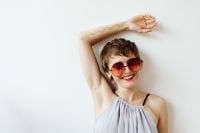 Kaboompics - Smiling Woman with Rainbow Body Paint on Her Arms and Chest