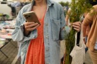 Kaboompics - Woman Checking Her Phone while Shopping for Fresh Herbs