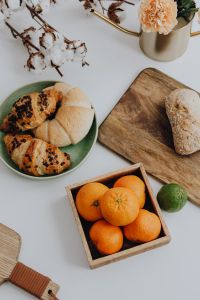 Kaboompics - Oranges and Pastries on a White Table