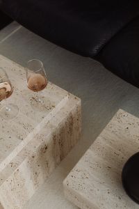 Kaboompics - Black Sofa and Travertine Tables in Bright Living Room