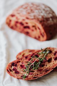 Kaboompics - Sliced Beetroot Bread with Thyme in Foreground