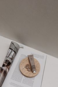 Kaboompics - UGC-Style Image of a Hand and Body Scrub Tube on a Neutral Background - Free Stock Photo