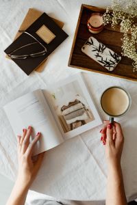 Woman read book and drink coffee
