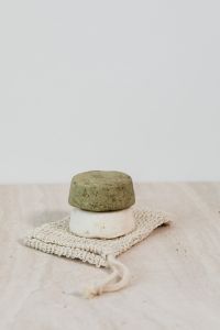 Kaboompics - Green and White Solid Soap Bars on a Crochet Washcloth for Plastic-Free Skincare