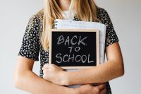 Kaboompics - Close Up of Student Holding Back to School Sign