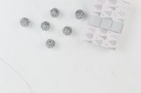 Kaboompics - Silver Christmas Baubles beside a Tree Print Gift Box on Marble