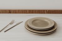 Kaboompics - Neutral Ceramic Plates and Cutlery on a White Table, Minimal Table Setting with Copy Space