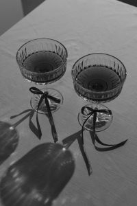 Kaboompics - Monochrome Crystal Cocktail Glasses with Black Ribbon Bows