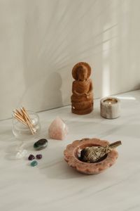 Kaboompics - Wide Meditation Altar With Buddha Sage Crystals And Candle