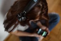 Kaboompics - Beautiful young woman in headphones listening to music