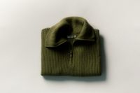 Kaboompics - Folded Olive Green Quarter Zip Sweater With Copy Space