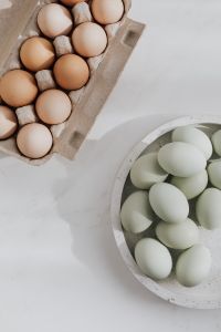 Kaboompics - Easter flat lay with green eggs on a white marble