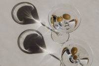 Kaboompics - Overhead Martini Glasses with Green Olives