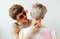 Kaboompics - Woman Painting a Rainbow Stripe on Her Partner's Neck
