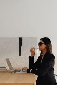 Kaboompics - Businesswoman Drinking Wine While Working on a Laptop