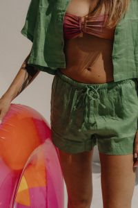 Kaboompics - Woman in Pink Bikini Top and Green Shorts, Summer Swimwear Close-Up