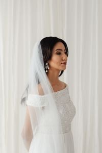 Kaboompics - Pantone 2026 Bridal Aesthetic: Woman in a White Lace Dress and Veil