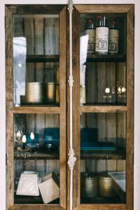 Kaboompics - Close Up Of Rustic Glass Display Cabinet With Vintage Decor