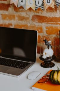 Kaboompics - Laptop With Pumpkin and Halloween Desk Decor