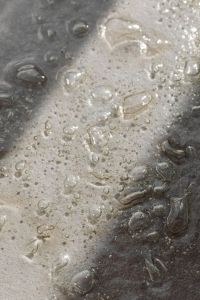 Kaboompics - Dark Gray Bubbled Glass Texture with Scattered Clear Forms