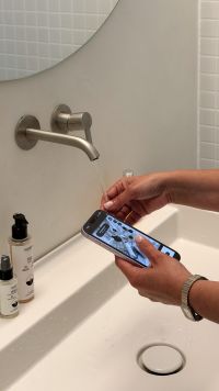 Kaboompics - Checking Content On Smartphone During Morning Routine