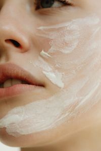 Kaboompics - Macro View of White Facial Cream Applied to Cheek and Jaw