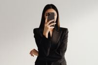 Kaboompics - Businesswoman Taking a Smartphone Selfie in a Black Suit