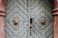 Kaboompics - Weathered White Door With Lion Head Knockers