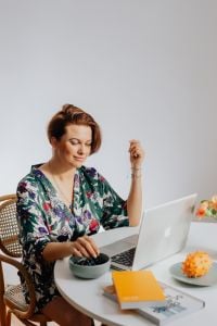 Kaboompics - Woman Eating Blueberries While Working on a Laptop at Home