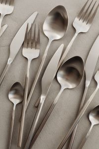 Kaboompics - Top View of Silver Forks, Spoons and Knives on Neutral Background