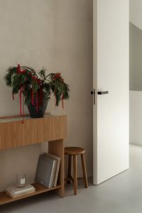 Kaboompics - Holiday Pine Arrangement with Red Ribbons on Wooden Console Table
