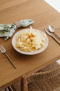 Kaboompics - White Flower Still Life on a Wooden Table with Cutlery