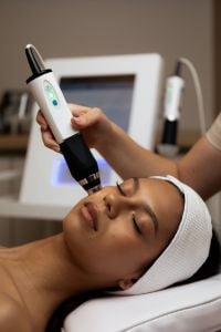 Kaboompics - Aesthetic Facial Treatment with Handheld Skin Device