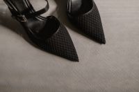 Kaboompics - Black Woven Slingback Heels on Neutral Fabric