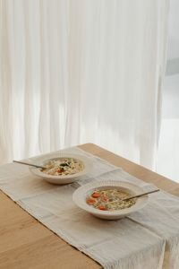 Kaboompics - Two Bowls of Chicken Soup on a Light Wood Table