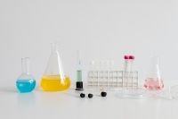 Kaboompics - Laboratory Test Tubes and Flasks With White Copy Space