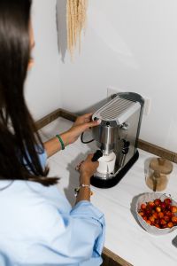 Kaboompics - Flash Photography Aesthetic of Woman Making Coffee with Espresso Machine