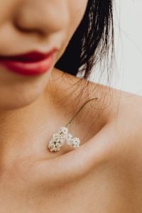 Kaboompics - Red Lipstick Beauty Close-Up with Dark Hair and Bare Shoulder of an Asian Woman