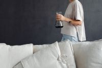 Kaboompics - Woman Enjoying Coffee in a Minimal Living Room