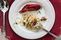 Kaboompics - Top-Down Crayfish and Seafood Pasta Plate with Red Tableware