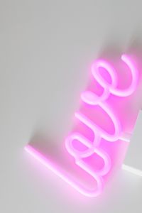 Kaboompics - Angled Pink Neon Love Sign With Copy Space