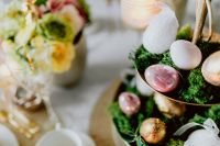 Kaboompics - Pastel Easter Eggs and a White Bunny on a Moss-Covered Spring Table Centerpiece