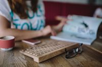 Kaboompics - Closeup of female hands typing text on a wireless wooden keyboard