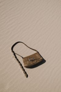 Kaboompics - Brown Leather Shoulder Bag on Sandy Beach