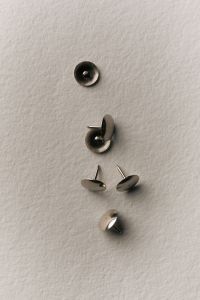 Kaboompics - Silver Push Pins on White Background