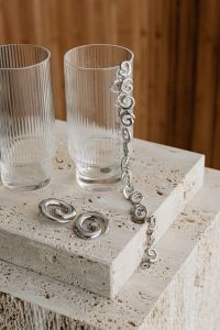 Kaboompics - Silver Earrings and Necklace with Ribbed Glasses